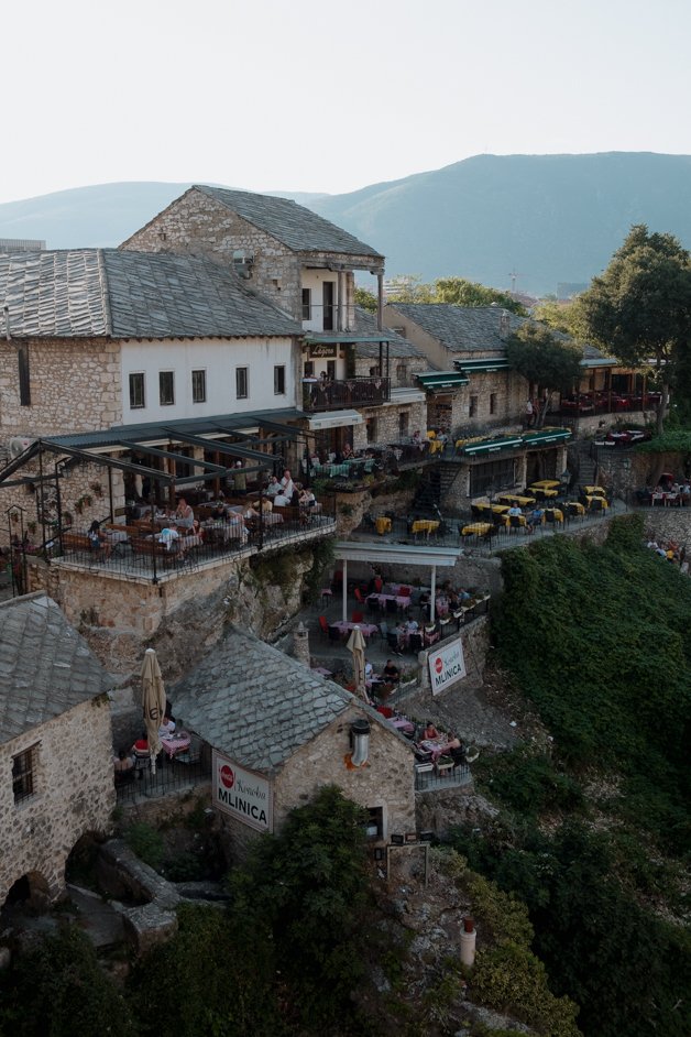 Where to Eat in Mostar The old town of Mostar is full of meal options; it felt like every other shop was a restaurant, so you certainly won't be hard-pressed to find something to eat. As it's fairly touristy here, you can expect more expensive prices compared to the rest of Bosnia and Herzegovina, but it was still much cheaper than compared to, for example, Croatia, just across the border. One evening I tried Food House, a spot known for having loads of vegan and vegetarian options on the menu just on the edge of the old town. Their platter was delicious, featuring a selection of few different traditional dishes to try. My second evening I went to Restaurant Divan, featuring a lot of traditional Bosnia and Herzegovinan dishes, with a gorgeous river view to beat.